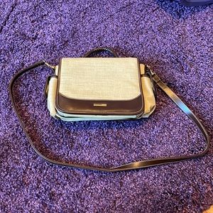 Vintage beige and brown handbag with handle and strap.
